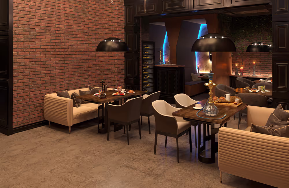 Modern restaurant dining area with brick wall, sofas, and soft ambient lighting