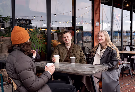 Friends chatting at an outdoor café